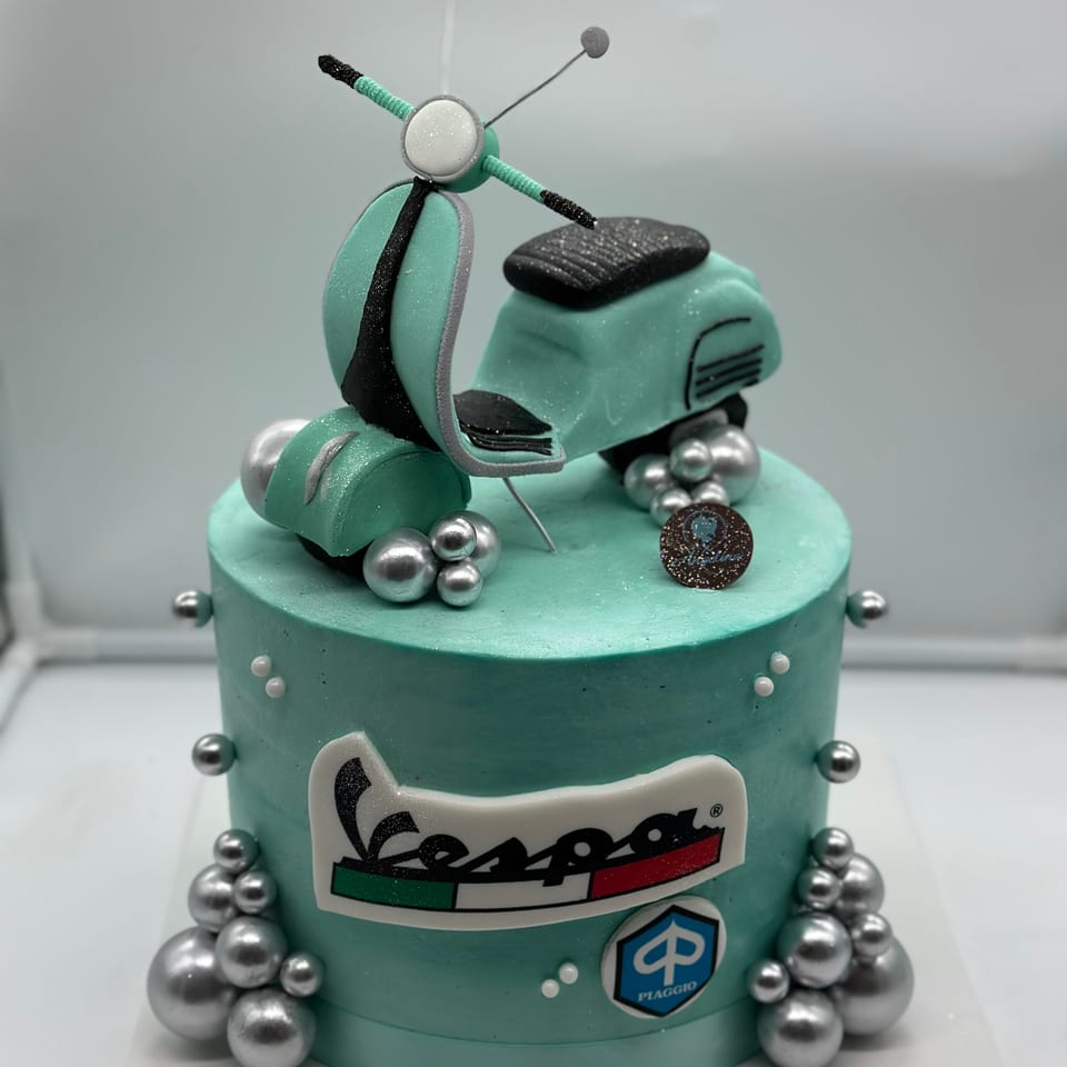Vespa scooter themed cake