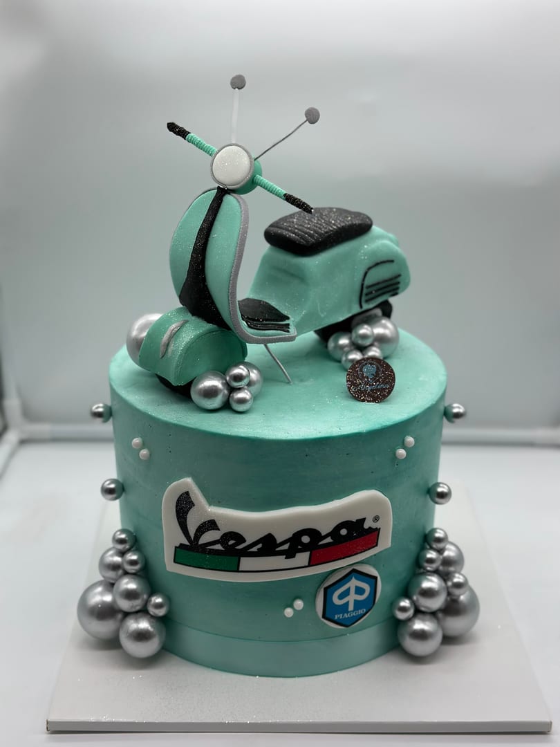 Vespa scooter themed cake
