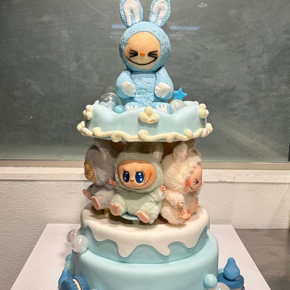Blue character baby shower cake