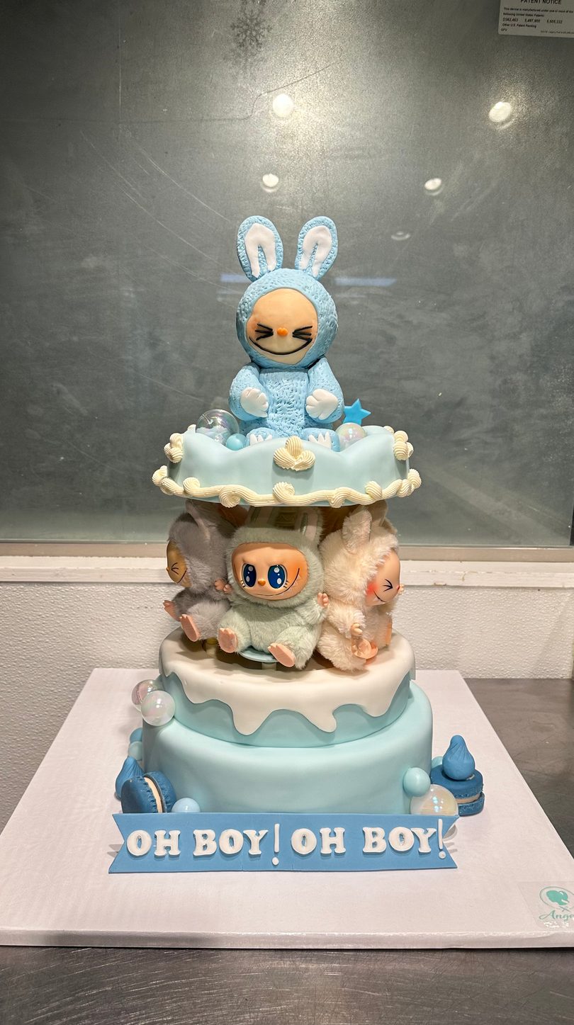 Blue character baby shower cake