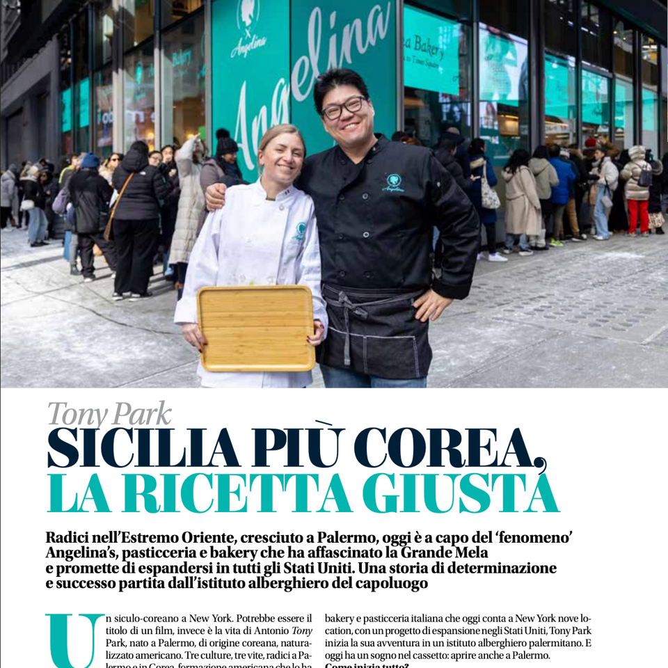 Two chefs pose outside Angelina bakery in New York, with a crowd gathered behind them and turquoise storefront signage.