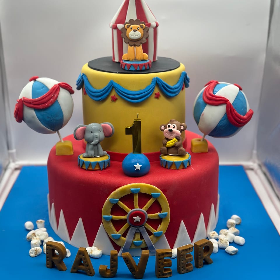 Circus-themed first birthday cake