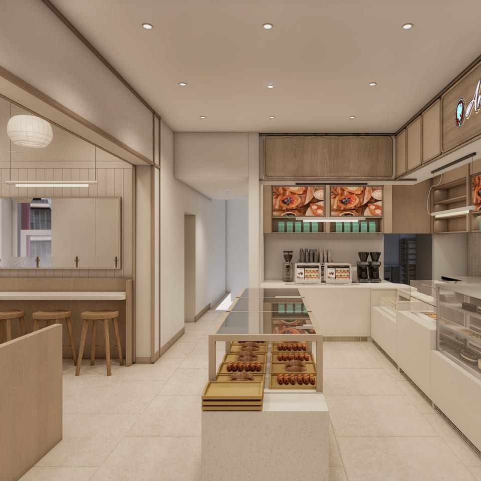 Rendering of the Angelina cafe with central pastry display, bar seating, and coffee station.